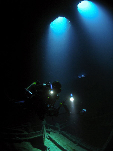 My friend Carlos inside the wreck of the WIT Shoal.  No s... by Juan Torres 